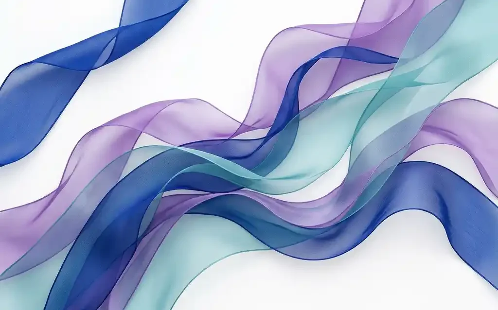 Translucent silk ribbons in cobalt blue, violet, and teal flowing in overlapping organic waves against a white background.